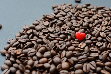 Coffee beans from the mountains of Colombia displayed in containers, watered on a flat backgroundの写真素材