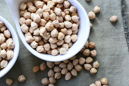 Cicer arietinum - Raw chickpeas displayed in containers watered on flat bottoms