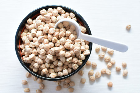 Cicer arietinum - Raw chickpeas displayed in containers watered on flat bottomsの写真素材