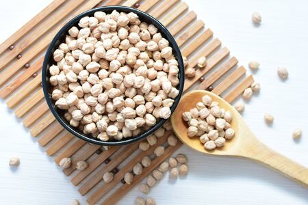 Cicer arietinum - Raw chickpeas displayed in containers watered on flat bottomsの写真素材