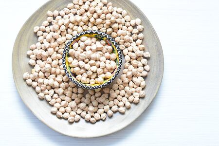 Cicer arietinum - Raw chickpeas displayed in containers watered on flat bottomsの写真素材