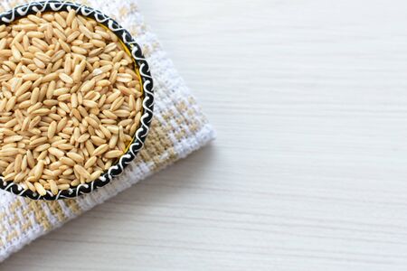 Avena sativa - Raw and natural watered grain oats, displayed in containers, flat bottomの写真素材