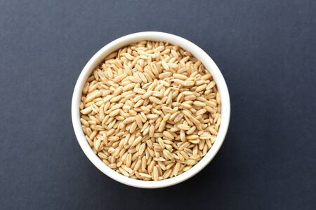 Avena sativa - Raw and natural watered grain oats, displayed in containers, flat bottomの写真素材