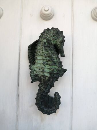 Knockers on the old gates of the walled city, different metal materials in the city of Cartagena de Indias - Colombiaの写真素材