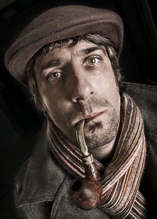 Sepia photograph of man smoking pipeの写真素材
