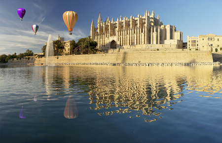 Majorca cathedral in Balearic Islands  and hot air balloonの写真素材