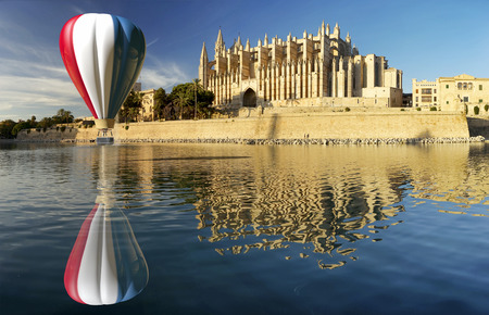 Majorca cathedral in Balearic Islands  and hot air balloonの写真素材