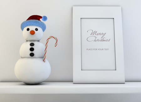Christmas concept with snowman and frame for a textの写真素材