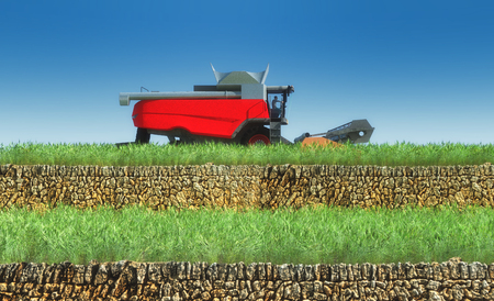 wheat harvester working in wheat fieldの写真素材