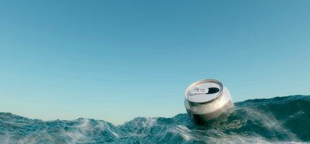 empty can floating in the oceanの写真素材