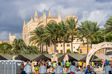 Palma de Mallorca, Spain, October 14, 2018.Fifteenth Palma Marathon, 42km with the Cathedral of Mallorca in the background.のeditorial素材