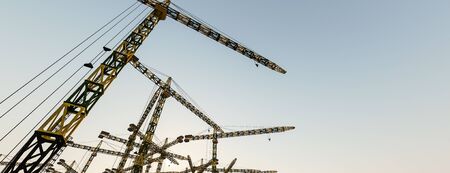 3d illustration of construction cranesの写真素材