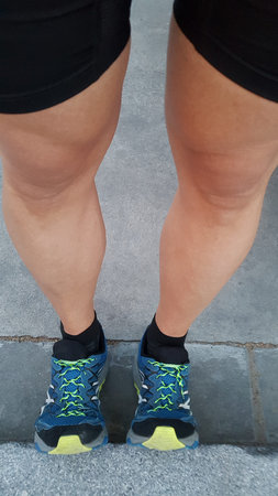 Mans legs stretching before going for a run.の写真素材