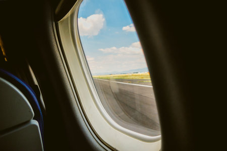 A Airplane window view with landscape outside and copyspace