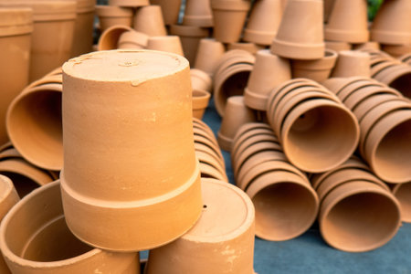 A stack of unpainted clay potsの写真素材