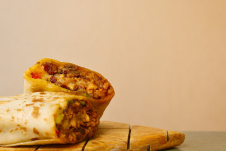 A Pastor mexican burrito with meat and hot sauceの写真素材