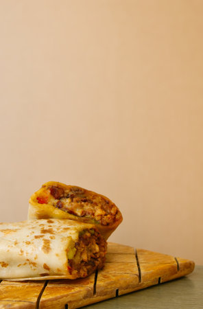 A Pastor mexican burrito with meat and hot sauceの写真素材