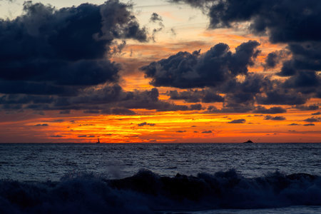 A Beautiful landscape of sunset on the beach with bluish cloudsの写真素材
