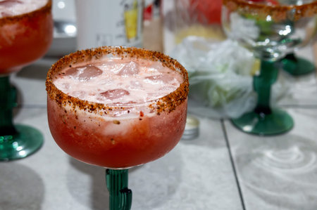 A cold michelada cocktail with clamato, chili and lemon, with space for text