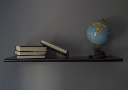 World ball and books on bookshelfの写真素材