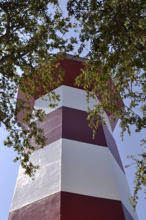 Lighthouse seen among the trees in Harbor Town, Hilton Head Island.の写真素材