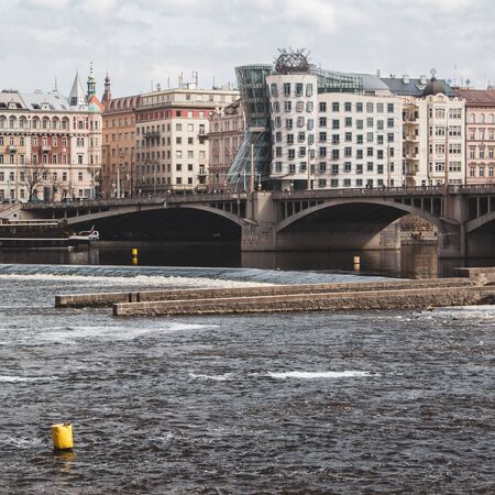 Dancing House in Prague viewed from the other side of the riverの写真素材
