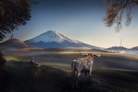 A bull and a deer facing each other on a fantasy landscape
