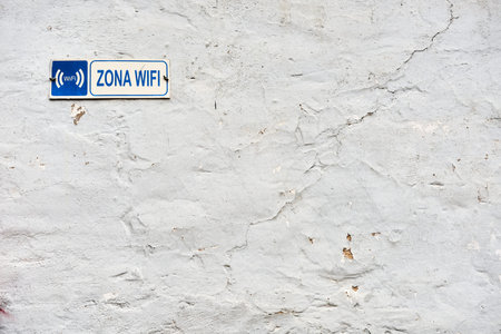 Detail of the old facade with sign WIFI ZONE