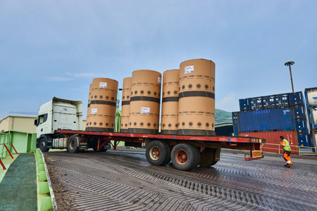 Lorry unloading paper rolls to the vessel in the Port of Bilbao, Biscay, Basque Country, Euskadi, Spain, Europeのeditorial素材