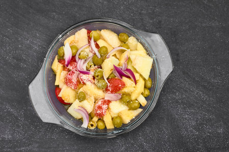 Fresh salad with cheese, olives tomatoes, red onion, fruits and corn