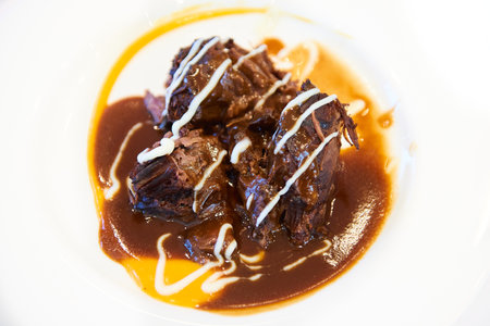 Delicious stewed veal served with wine sauce and potato pureeの写真素材