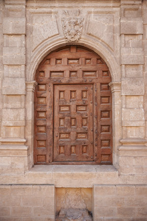 Small wooden door on the facade of the Cathedral of Burgos; Burgos, Spainのeditorial素材