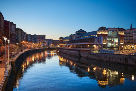 View of the Nervion river and Rivera market at evening, Bilbao, Biscay, Basque Country, Euskadi, Euskal Herria, Spain, Europe.のeditorial素材