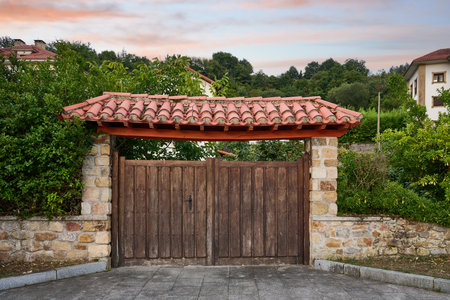 Rustic access porch to the farm with wooden door and upper roof with tileのeditorial素材