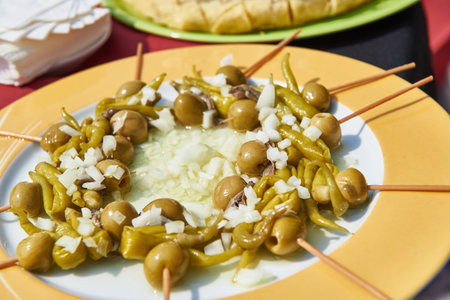 Pintxos of hot peppers, olives and anchovies called Gilda, typical of Basque Country