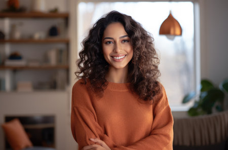 Smiling young woman relaxing at homeの素材