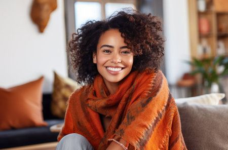 Happy woman chilling at home in a winter sceneの素材
