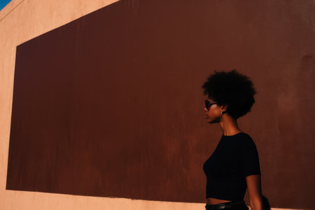 African American young woman in a Mediterranean architectural sceneの素材