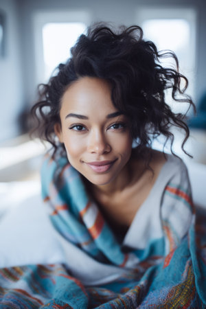 Smiling young woman chilling at homeの素材