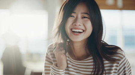 Young Asian woman enjoying the comfort of her homeの素材