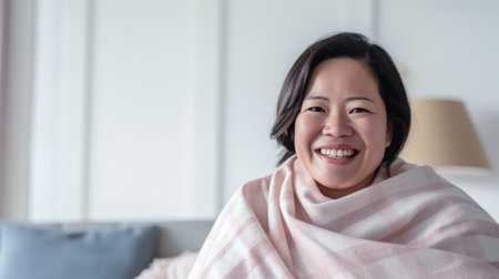 Young Asian woman enjoying the comfort of her homeの素材