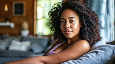 Young African American woman relaxing at homeの素材