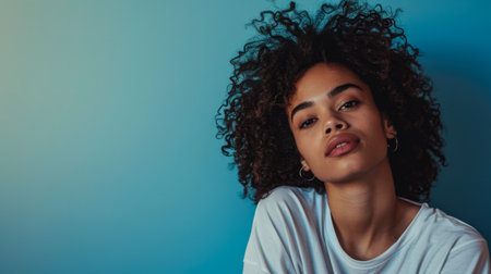 Young woman posing in front of clean background.Copyspace for text.の素材