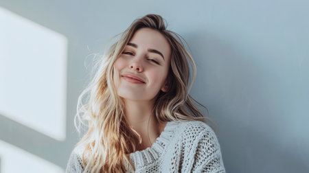 Young woman posing in front of clean background.Copyspace for text.の素材