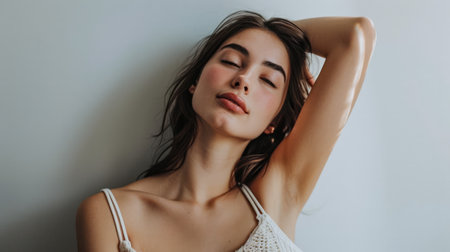 Young woman posing in front of clean background.Copyspace for text.の素材