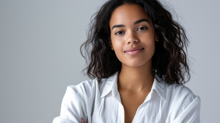 Young woman posing in front of clean background.Copyspace for text.の素材