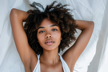 Young woman posing in front of clean background.Copyspace for text.の素材