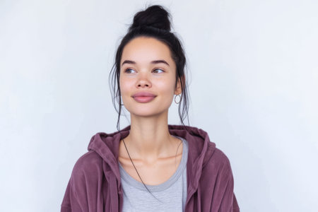 Close up portrait of a happy young woman isolated from a white background copy space for text.の素材