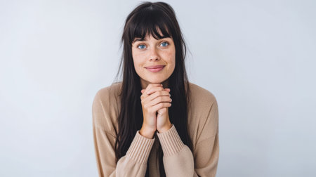 Close up portrait of a happy young woman isolated from a white background copy space for text.の素材