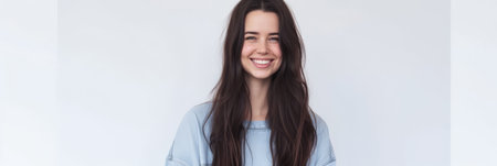 Close up portrait of a happy young woman isolated from a white background copy space for text.の素材